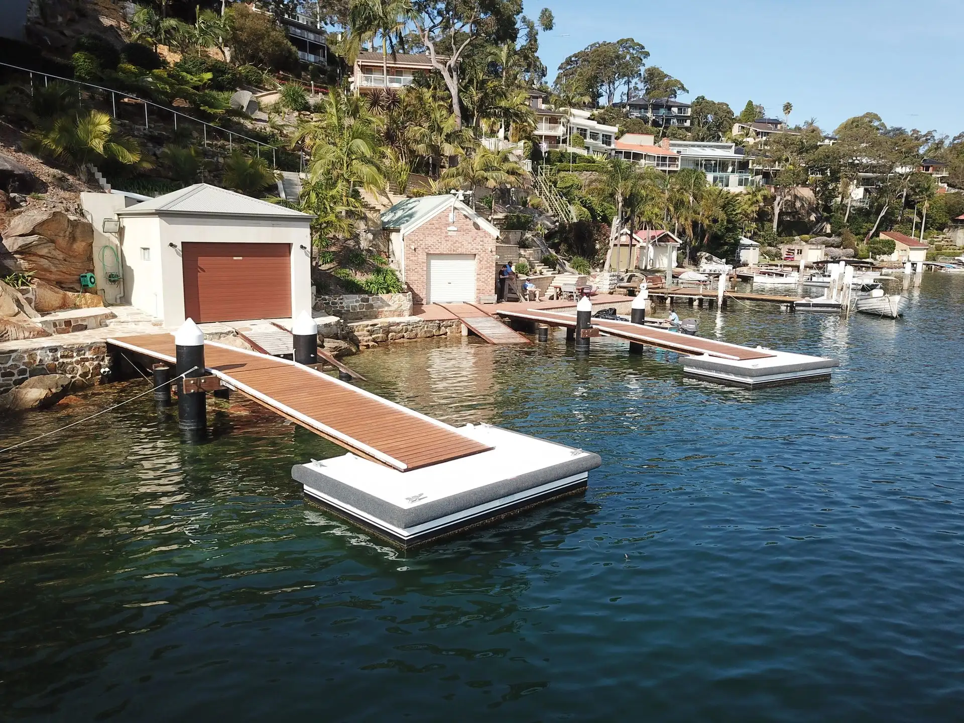 Aerial view of a Kingtide Marine jetty, floating dock and boathouse on a Port Hacking River waterfront